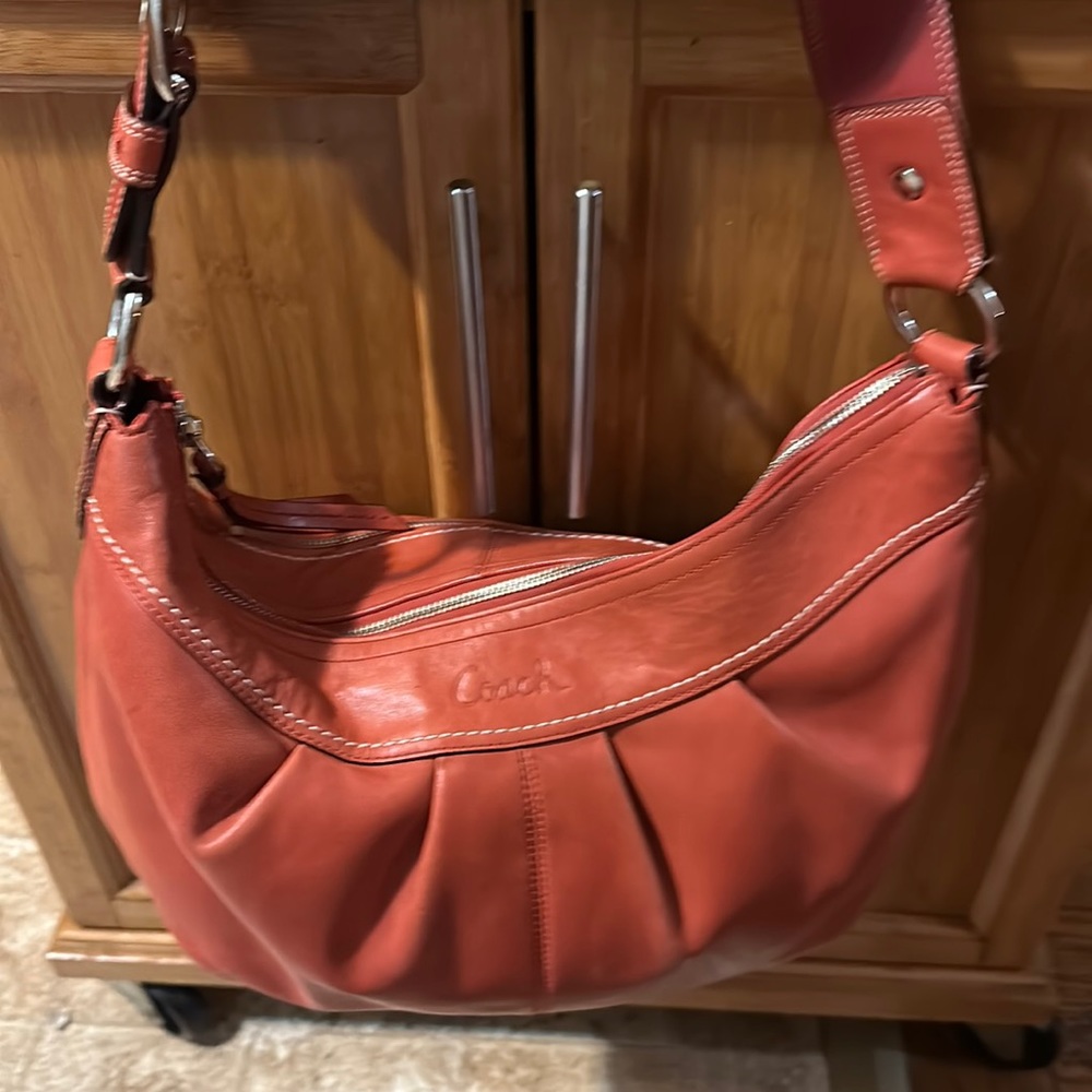 100% authentic burnt orange coach